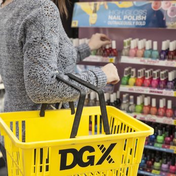 DGX - a woman holding a shopping basket in a store - Discount Store Near Me - Omaha, Nebraska