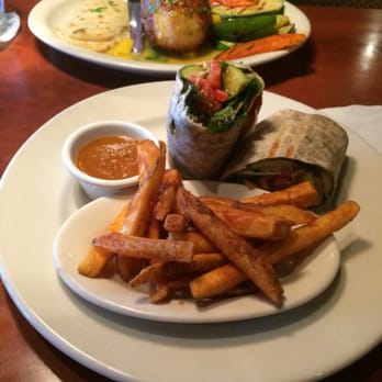Mezza Grille - Grilled veggie wrap and mango stuffed chicken behind. - Mediterranean Near Me - Houston, Texas Mezza Grille - Grilled veggie wrap and mango stuffed chicken behind. - Mediterranean Near Me - Houston, Texas