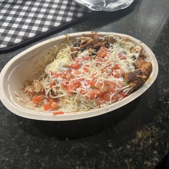 Chipotle Mexican Grill - Supposedly $13 worth of a double chicken burrito bowl that is half filled - Mexican Near Me - Matthews, North Carolina
