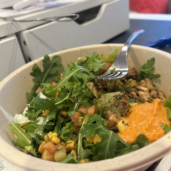 CAVA - Half full bowl of salad with undercooked chicken. Lame - Mediterranean Near Me - Wayne, New Jersey