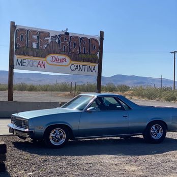 Off Road Diner Mexican Cantina - a car parked in front of a sign - Mexican Near Me - Golden Valley, Arizona