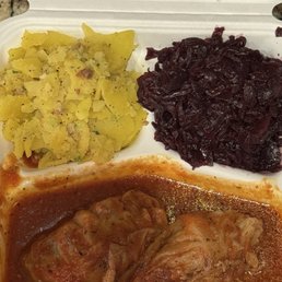 Cabbage rolls, potato salad and red cabbage. Cabbage rolls, potato salad and red cabbage.