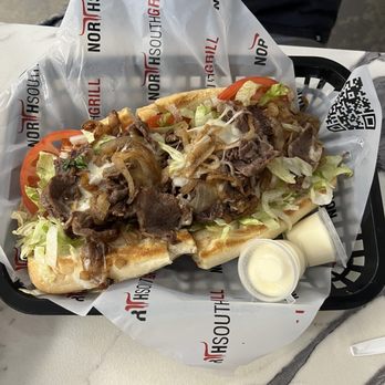 North South Grill - Classic steak sandwich with grilled onions and Durborow onions - Burgers Near Me - Pembroke Pines, Florida