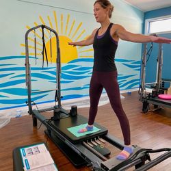 Empower PT - Student practicing Pilates for her certification with Empower PT