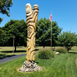 Tippecanoe County Amphitheater - Ash Tree Carving by Jason Bord can be seen near the amphitheater entrance
