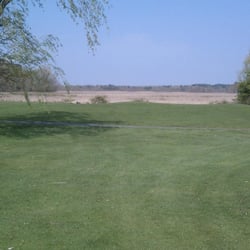 King Rail Reserve Golf Course - Many of the holes directly border the wetlands - that's the yellowish-hay area in the background you see here.