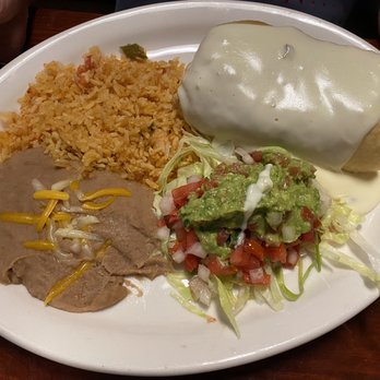Mexico's Grill - Fried chicken chimichanga, Spanish rice, and retried beans with a side of pico. - Mexican Near Me - Cocoa Beach, Florida