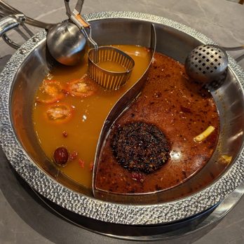Szechuan Mansion Hotpot - Yin Yang Pot. Left is Organic Tomato Pork Broth. Right is Beef Tallow Mala Hotpot. - Hot Pot Near Me - Durham, North Carolina Szechuan Mansion Hotpot - Yin Yang Pot. Left is Organic Tomato Pork Broth. Right is Beef Tallow Mala Hotpot. - Hot Pot Near Me - Durham, North Carolina