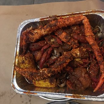 Mr. & Mrs Crab - 1 pound snow crab, 1 pound of Manila clams and 1 pound crawfish..in special spicy sauce  A dozen of raw oysters - Seafood Near Me - Bradenton, Florida