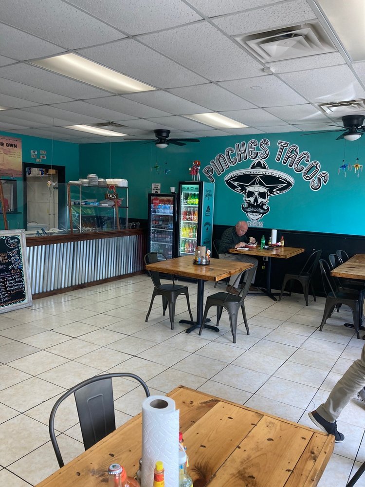 PINCHES TACOS SHACK Logo