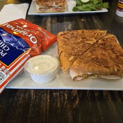 Van Gogh Coffeehouse - The Turkey Firehouse Panini with a side of chips