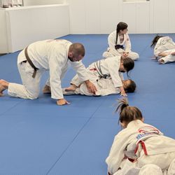 Assisting students with their "eat the knee" technique.