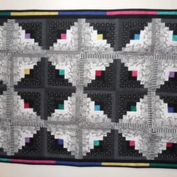 Willow Creek Cafe - Willow Creek Cafe & Store - "Log Cabin in the Round: quilts on walls inside by owner Bev Vickery