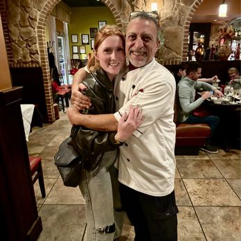 Manalu Italian Restaurant - Hannah's birthday hug with owner Marco - Italian Near Me - Frederick, Maryland