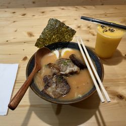 Yoki Hibachi & Tea - Spicy Tonkotsu, ramen noodles, pork protein. Small Mango smoothie with mango jelly.