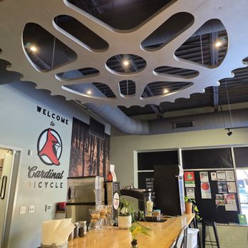 Cardinal Bicycle Cafe - The Café counter with the entrance to the kitchen. - Bikes Near Me - Roanoke, Virginia