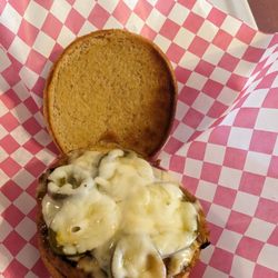 Reno & Woody's - The Italian- Grazianos sausage pattied, topped with mozzarella and served on a brioche bun. Add banana peppers or jalapenos.