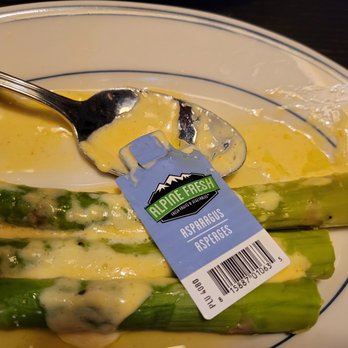 Pittsburgh Blue - a plate of asparagus with cheese sauce - Steakhouses Near Me - Rochester, Minnesota Pittsburgh Blue - a plate of asparagus with cheese sauce - Steakhouses Near Me - Rochester, Minnesota