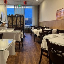 a restaurant with tables and chairs a restaurant with tables and chairs