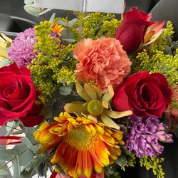 North Side Florist - Bright and shiny arrangement! She even provided a box for easy transport!
