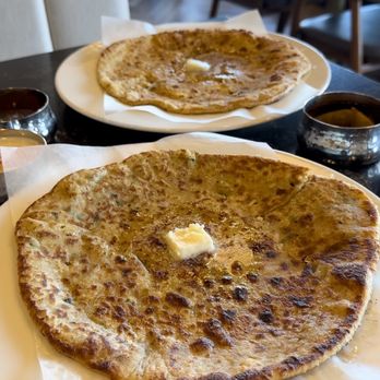 The Yellow Chilli - two flatbreads with butter on them - Indian Near Me - Delta, British Columbia