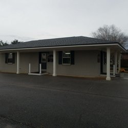 Pilcher's Barber Shop - Outside. Painted grey. Rainy day :(