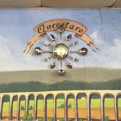 Taqueria Perlitas - A spoon and fork clock.