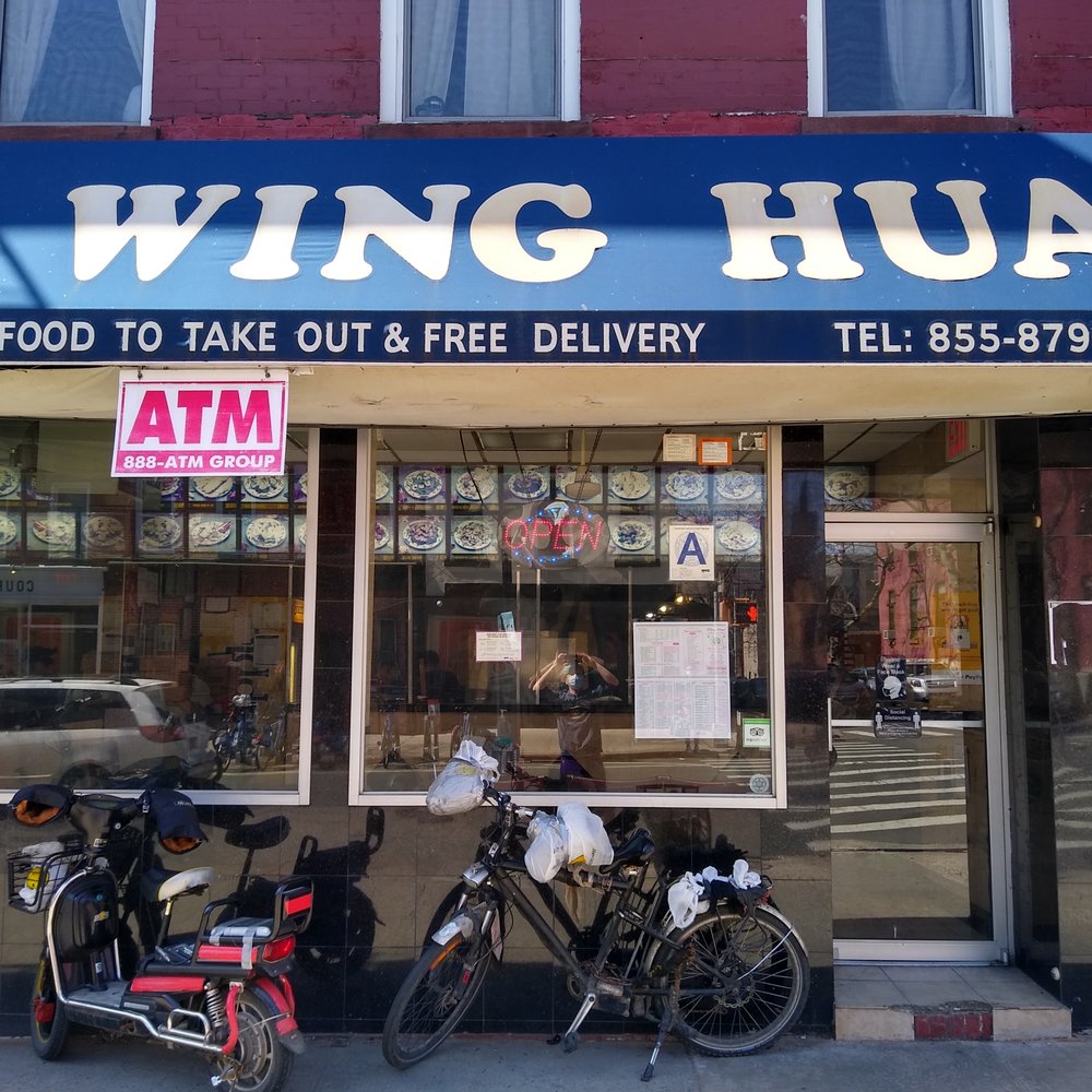 Wing Hua - two motorcycles parked in front of a restaurant - Chinese Near Me - Brooklyn, New York
