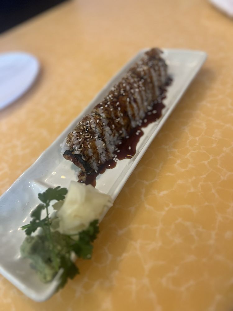 Eel and shrimp sushi roll with fresh sashimi.