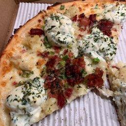 a half eaten pizza in a box a half eaten pizza in a box