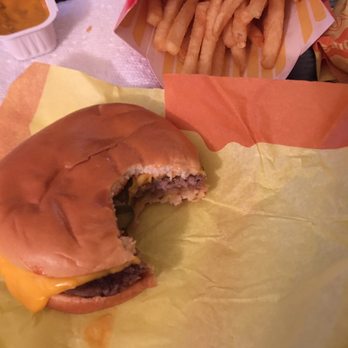 McDonald's - Smashed burger with a bite and a half full fry - Fast Food Near Me - Loma Linda, California