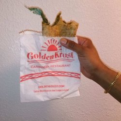 Golden Krust - Green plastic found in spinach patty.