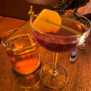 Swoony's - two glasses of alcohol on a table - New American Near Me - Brooklyn, New York Swoony's - two glasses of alcohol on a table - New American Near Me - Brooklyn, New York