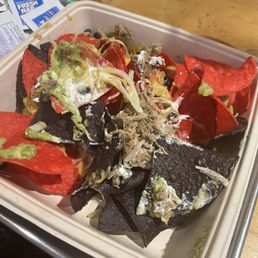 The nachos with pulled pork... The nachos with pulled pork...