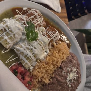 Sergio's Cantina - Two chicken enchiladas half red half green sauce - Mexican Near Me - Lahaina, Hawaii Sergio's Cantina - Two chicken enchiladas half red half green sauce - Mexican Near Me - Lahaina, Hawaii