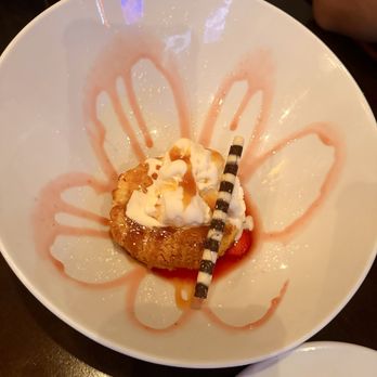 Wildfire Public House - Brown Butter Cake - $12.00 Brown butter cake topped with caramel sauce, vanilla ice cream, fresh strawberries, chocolate cigar, fresh mint. - Breakfast & Brunch Near Me - Modesto, California