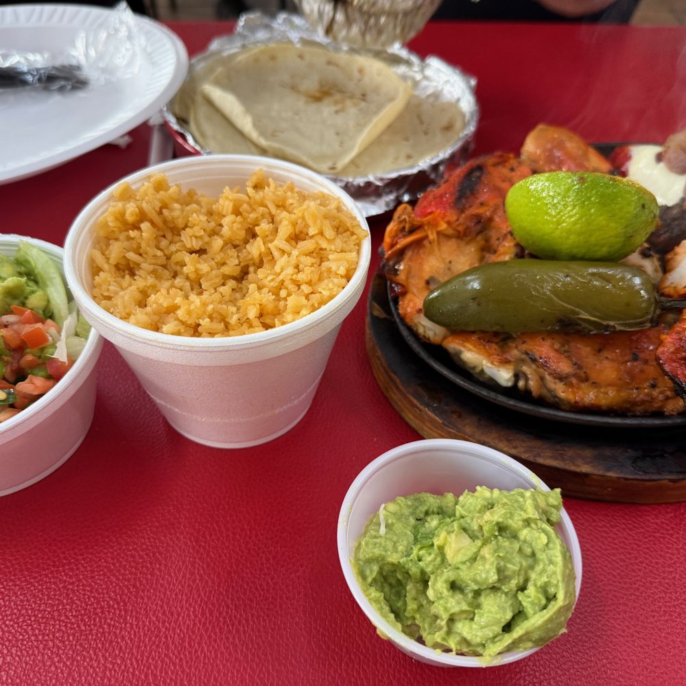 Al Carbon - Culebra 1 - Condiments include Spanish rice, guacamole, pico de Gallo, and tortillas. - Chicken Shop Near Me - San Antonio, Texas