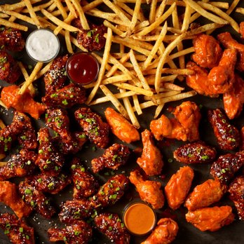 Wings Out - a tray of chicken wings and french fries - Food Delivery Services Near Me - Bellevue, Washington Wings Out - a tray of chicken wings and french fries - Food Delivery Services Near Me - Bellevue, Washington