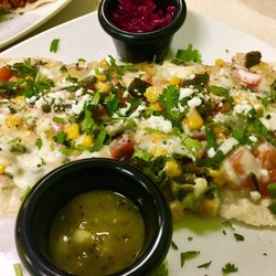 Xicamiti La Taquería Bistro - Veggie taco with corn, roasted poblano peppers, onion, tomato, and cheese. Served with pickled cabbage and salsa.