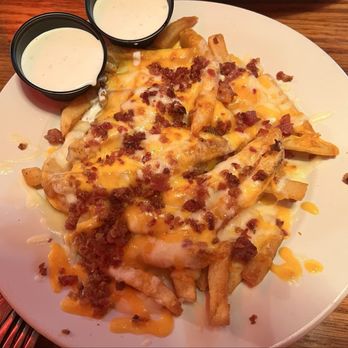 Logan's Roadhouse - Roadhouse cheese fries appetizer w/ ranch dipping sauce - Barbeque Near Me - Statesville, North Carolina Logan's Roadhouse - Roadhouse cheese fries appetizer w/ ranch dipping sauce - Barbeque Near Me - Statesville, North Carolina