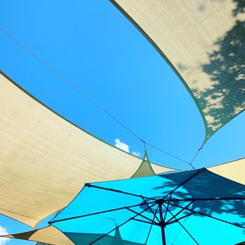 The Barn - a blue and white umbrella with a blue sky in the background - Breakfast & Brunch Near Me - Little Compton, Rhode Island The Barn - a blue and white umbrella with a blue sky in the background - Breakfast & Brunch Near Me - Little Compton, Rhode Island