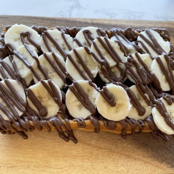 Sugar Rush Waffles & Crepes - a chocolate drizzle drizzle on top of a waffle topped with bananas - Creperies Near Me - Bremerton, Washington Sugar Rush Waffles & Crepes - a chocolate drizzle drizzle on top of a waffle topped with bananas - Creperies Near Me - Bremerton, Washington
