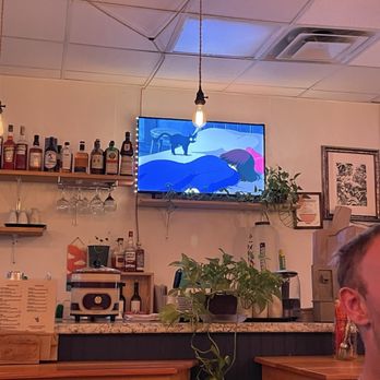 New Wave Kitchen - Inside with Studio Ghibli movies playing - Ramen Near Me - Wakefield, Rhode Island