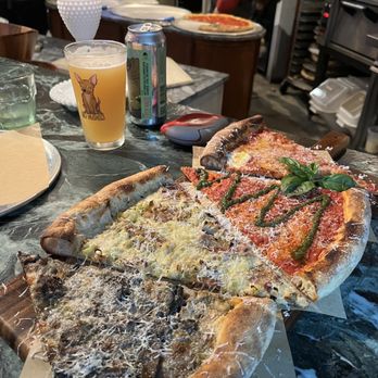 Miami Slice - From top to bottom: margarita, la salsera, leeks on bacon, and mushroom truffle - Pizza Near Me - Miami, Florida Miami Slice - From top to bottom: margarita, la salsera, leeks on bacon, and mushroom truffle - Pizza Near Me - Miami, Florida