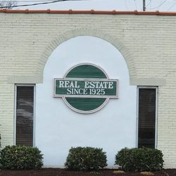 Chalk & Gibbs Insurance & Real Estate - Chalk and Gibbs Real Estate sign on their building.