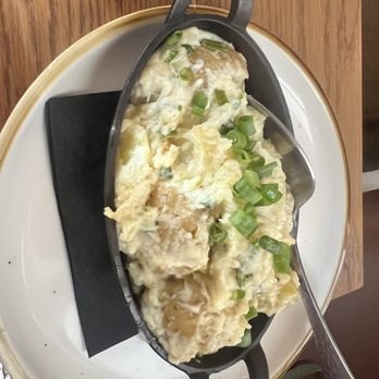 Taverna Philosophia - Smashed goat cheese potatoes - Mediterranean Near Me - Mount Pleasant, South Carolina Taverna Philosophia - Smashed goat cheese potatoes - Mediterranean Near Me - Mount Pleasant, South Carolina