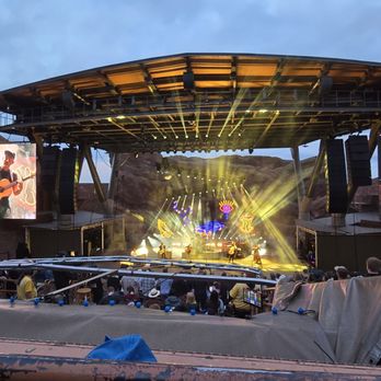 Red Rocks Amphitheatre - View of the stage from about the middle. Big screens really help a lot. - Music Venues Near Me - Morrison, Colorado Red Rocks Amphitheatre - View of the stage from about the middle. Big screens really help a lot. - Music Venues Near Me - Morrison, Colorado