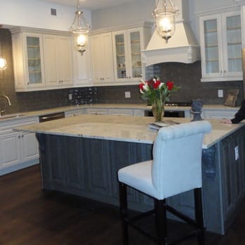 D.W. Grant Construction -  a woman in a kitchen - General Contractors Near Me