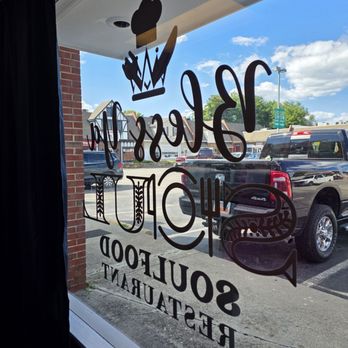 Bless Ya Soul - The window with the restaurant's name on it as seen from the inside. - Soul Food Near Me - Roanoke, Virginia