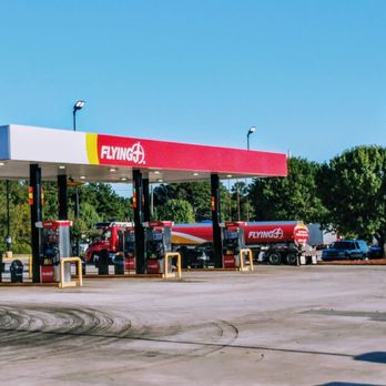 Flying J Travel Center - the car gas islands and the parking lot four cars for the Denny's and travel store - Gas Stations Near Me - Jackson, Georgia